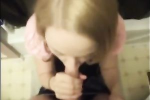 Cute colleague in her office suit sucks and swallows