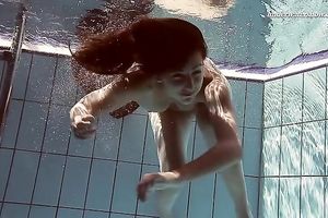 Hot pale skin new hottie from Europe disrobes underneath water