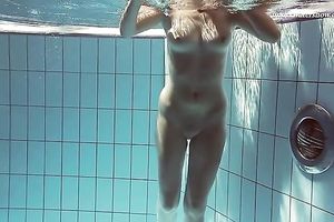 Hot pale skin new hottie from Europe disrobes underneath water