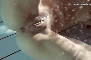 Hot pale skin new hottie from Europe disrobes underneath water