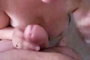 Busty and glamorous girlfriend playfully engulfing cock