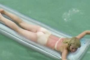 Cute golden-haired eats 10-Pounder on the inflatable mattress on webcam