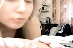 Auburn BBC slut in headphones got busy with blowing a alluring bulky prick