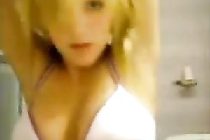 Hot and skanky golden-haired legal age teenager takes off her pants on cam