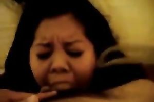 Asian overweight whore blows my hard dong greedily