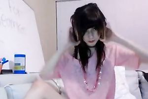 Cute doll with wonderful tats enchanting herself with sex toys