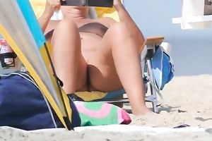 Amateur mother I'd like to fuck with large rack was sitting and flashing her love tunnel on the beach