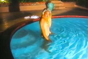 Skinny and juvenile model in white concupiscent costume stripteases