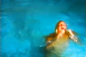 Skinny and juvenile model in white concupiscent costume stripteases