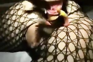 Dirty hotwife in fishnets inserts smartphone and plastic doll in her booty