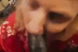 Whorish older woman likes sucking huge dark poles on a camera
