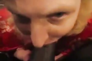 Whorish older woman likes sucking huge dark poles on a camera