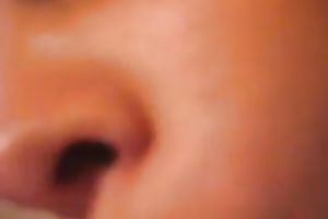 Big boobed girl engulfing large sex-toy and playing with her bushy vagina in solo clip