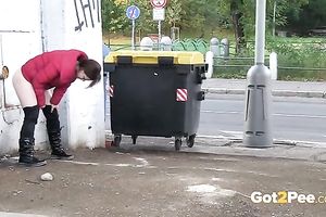 Piss fetish episode with a skank doing her juicy business in the street