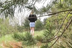 Cute redhead Russian housewife in the forest strips and pisses