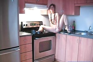 Super concupiscent hottie is masturbating on the kitchen counter