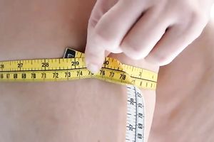 Gorgeous golden-haired housewife measuring her large round ass