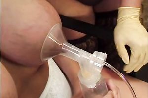 Busty beauty acquires fastened up and pumped milk from her titties