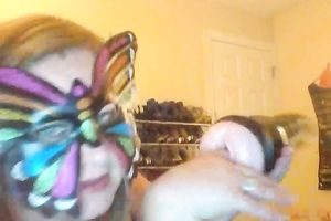 Wearing butterfly mask blonde haired cam whore was playing with a toy
