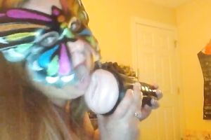 Wearing butterfly mask blonde haired cam whore was playing with a toy
