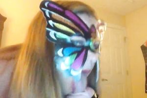 Wearing butterfly mask blonde haired cam whore was playing with a toy