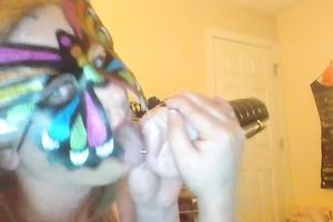 Wearing butterfly mask blonde haired cam whore was playing with a toy
