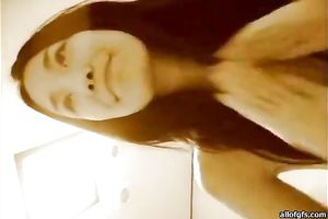 Pretty and sexually excited Asian bimbo rides her man's jock in cowgirl position