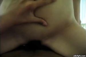 Pretty and sexually excited Asian bimbo rides her man's jock in cowgirl position