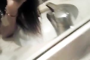 Cute Asian taped herself playing with sextoy in the washroom