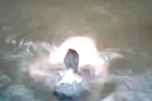 Hot and breasty dilettante teen honey swimming bare in the river