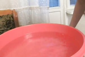 Bosomy blonde haired dyed floozy flashes her boobies at home