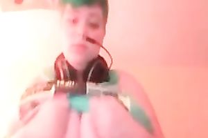 Green haired slutty amateur web camera nympho showed off her massive breasts