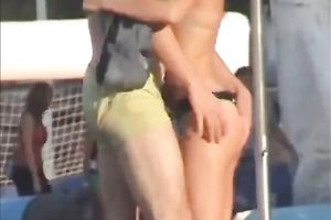 Sexy babe on the beach lets her boyfriend rub her muff