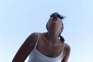 Skanky brunette hair legal age teenager finger copulates her moist cunt outdoors