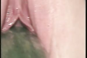 Wet and hairless pink vagina with a smooth fresh cucumber