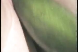 Wet and hairless pink vagina with a smooth fresh cucumber