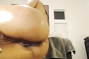 Sexy oiled and leggy black haired babe was teasing her own pleasant vagina