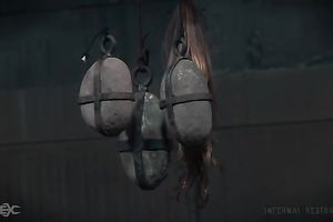 Busty white slutty wife is suspended undressed upside down in the basement