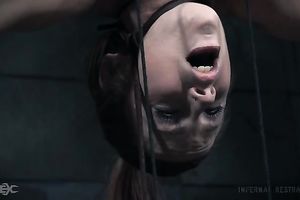 Busty white slutty wife is suspended undressed upside down in the basement