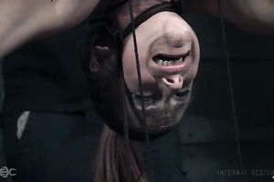 Busty white slutty wife is suspended undressed upside down in the basement