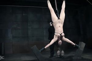 Busty white slutty wife is suspended undressed upside down in the basement