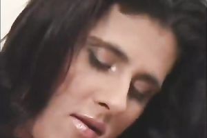 Hot blooded brunette tramp in astounding sex costume fingers her kitty greedily