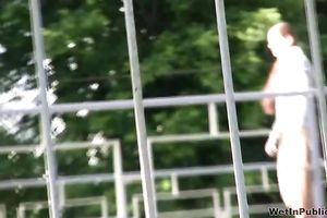 Brunette boy in khaki panties acquires all wet in the park