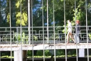 Brunette boy in khaki panties acquires all wet in the park