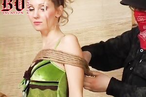 Slim and hot golden-haired hottie is bound up and stripped