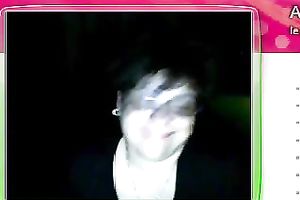 Fat granny sits in front of the web camera and rubs her fanny