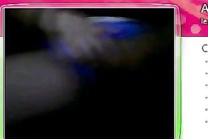 Fat granny sits in front of the web camera and rubs her fanny