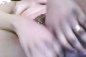 Dirty dark slut stretches her muff with fingers on web camera