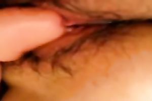 Wife likes pushing her shaggy cunt with large plastic sex-toy