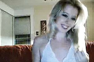 Playful blondie on the daybed shows her vagina and masturbates